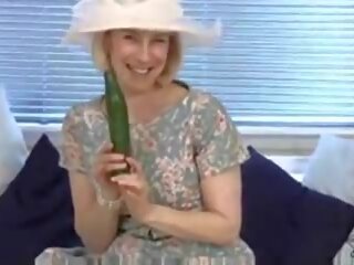 Marriageable housewife fucks a cucumber