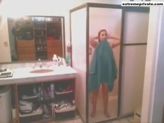 My mom in the bathoom unaware of spy camera